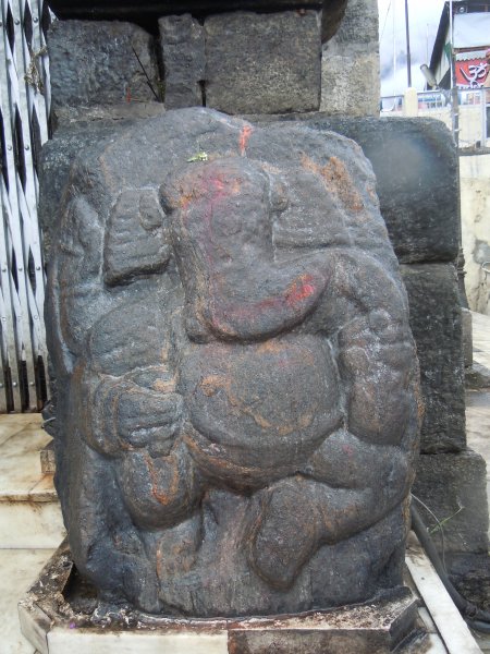 Cute little Ganesha sitting At his home on  the lap of his father