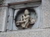 Bala Krishna sculpted on one side on the wall of Temple entrance